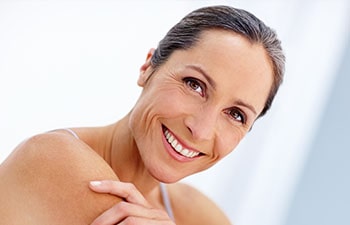 Cropped portrait of a beautiful mature woman posing in studio