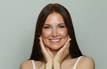 Perfect 50s middle aged mature woman looking at camera