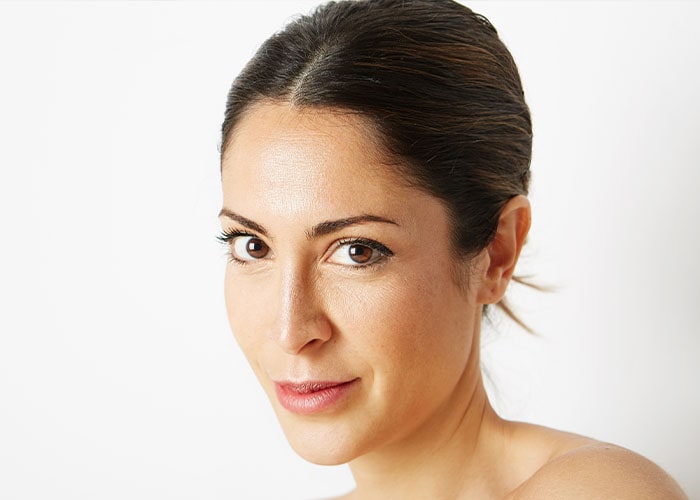 Beautiful Face of Woman with Clean Fresh Skin close up isolated on white