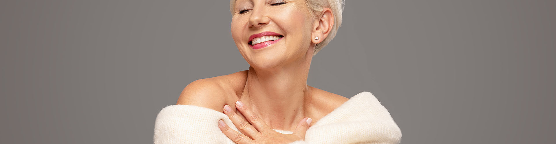 Beauty portrait of smiling adult blonde woman with short hairstyle
