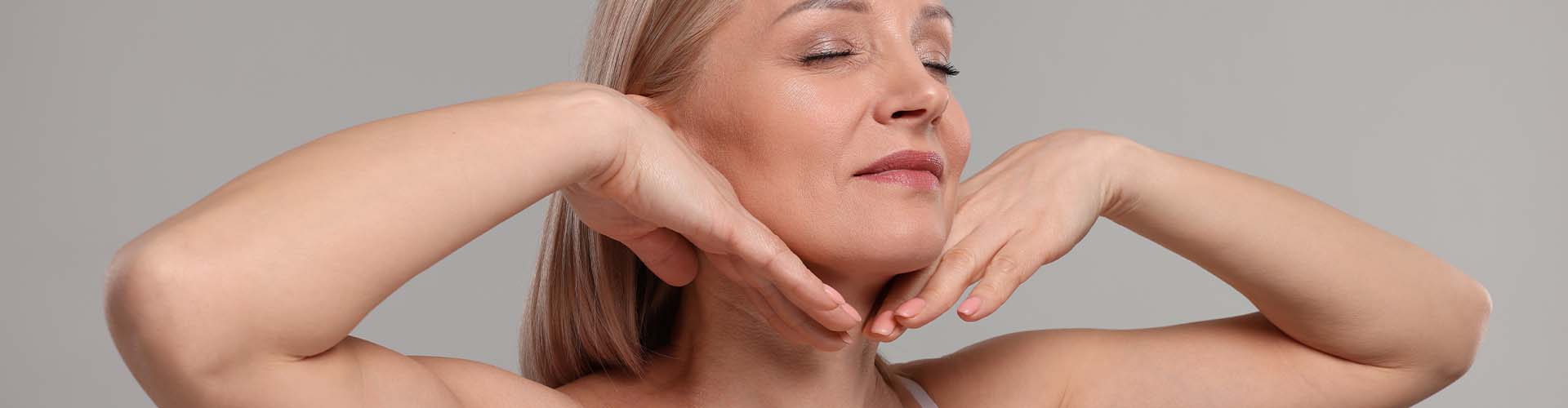 Beautiful woman touching her neck